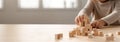 Kid playing with colorful wooden toy blocks. Little boy or girl building tower of block toys. Educational and creative Royalty Free Stock Photo