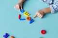 Kid playing with lego alphabets Royalty Free Stock Photo