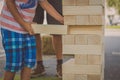 Kid playing a big jenga game Royalty Free Stock Photo