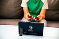Kid playing Nintendo Switch video game console