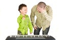 Kid playing piano badly