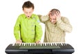 Kid playing piano badly Royalty Free Stock Photo