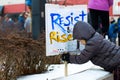 Kid playing with the poster during protests