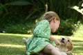 Kid playing with puppy Royalty Free Stock Photo