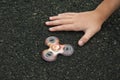 Kid playing with spinner on the playground.