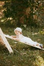 Kid playing sport in children's slide on the sports complex. 1,5 year old toddler baby climbing up the gymnastic stairs