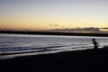 Kid playing at sunset