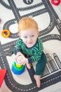 Kid plays developing toys Royalty Free Stock Photo