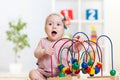 Kid plays with educational toy Royalty Free Stock Photo