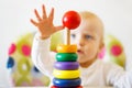 The kid plays the pyramid. child playing with a toys Royalty Free Stock Photo