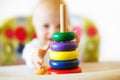 The kid plays the pyramid. child playing with toys Royalty Free Stock Photo