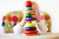 The kid plays the pyramid. child playing with toys Royalty Free Stock Photo