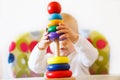 The kid plays the pyramid. child playing with toys Royalty Free Stock Photo