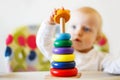 The kid plays the pyramid. child playing with toys Royalty Free Stock Photo