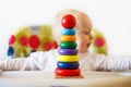 The kid plays the pyramid. child playing with toys Royalty Free Stock Photo