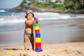 Kid plays with toys at the seashore in summertime Royalty Free Stock Photo