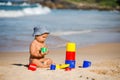 Kid plays with toys at the seashore in summertime Royalty Free Stock Photo