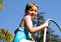 Kid on the Pool Slide Royalty Free Stock Photo