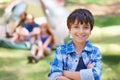Kid, portrait and smile on camping adventure in outdoors, happy and relaxing on vacation or holiday. Male person, child