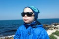 Kid posing on black sea background Royalty Free Stock Photo