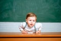 Kid preschooler Science education concept. Prechool kids against green chalkboard.