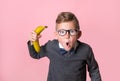 Kid pretend to be a boss. Face of little irritated business man in glasses and shirt looking with anger in camera