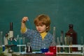 Kid from primary school. Chemistry lesson. Elementary school. Chemistry science. September 1. Science and education Royalty Free Stock Photo