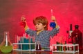 Kid from primary school. Elementary school. It was a little chemistry experiment. Back to school and home schooling Royalty Free Stock Photo