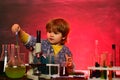 Kid from primary school. What is taught in chemistry. Little children at school lesson. Cheerful smiling little boy Royalty Free Stock Photo