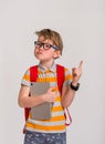 Kid professor. Student boy in glasses pointing finger up on white background. with tablet computer pointing up with a