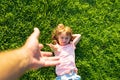 Kid pull father hand. Follow me, hand-in-hand walking on bright sunny day. Child holding man& x27;s hand and leading him on