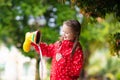 Kid with rain boots. Waterproof wear for children