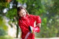 Kid with rain boots. Waterproof wear for children