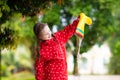 Kid with rain boots. Waterproof wear for children Royalty Free Stock Photo