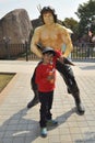 Kid with Rambo statue at Ramoji film city, hyderabad Royalty Free Stock Photo