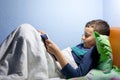 Kid reading a book at bedtime Royalty Free Stock Photo