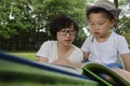 Kid reading with mom together Royalty Free Stock Photo