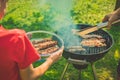 Kid recieving meat on a picnic