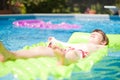 Kid Relaxing in Pool