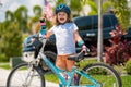 Kid ride bike. Child riding bicycle. Little kid boy in helmet on bicycle along bikeway. Happy cute little boy riding Royalty Free Stock Photo