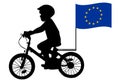 A kid rides a bicycle with European Union flag Royalty Free Stock Photo