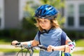 Kid riding bike in a helmet. Child riding bike in protective helmet. Safety kids sports and activity. Happy kid boy Royalty Free Stock Photo