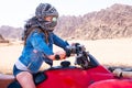 Kid riding quad bike in desert Royalty Free Stock Photo