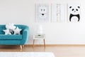 Kid room with turquoise couch Royalty Free Stock Photo