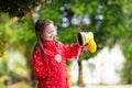 Kid with rain boots. Waterproof wear for children