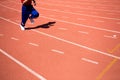 Kid runing on track in the Stadium