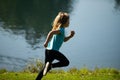 Kid runners run in park. Sporty young child jogging and training outdoor. Active energetic childhood. Royalty Free Stock Photo