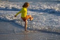Kid running on beach having fun on summer holidays. Happy kids playing on sea. Children in nature with sea. Happy kids Royalty Free Stock Photo