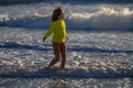 Kid running on beach having fun on summer holidays. Happy kids playing on sea. Children in nature with sea. Happy kids Royalty Free Stock Photo