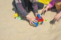 Kid`s hand playing with a toy truck in the sand Royalty Free Stock Photo